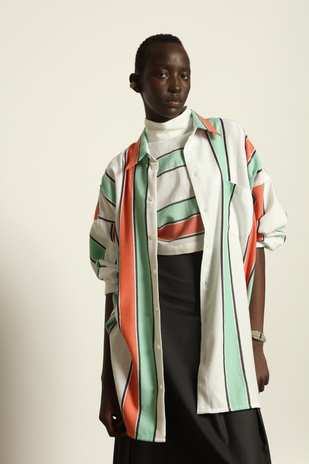 Model is wearing the Oversized Shirt with Collar by Marrakshi Life, part of House of Nomad Stories collection, handwoven cotton shirt with relaxed architectural fit, structured collar, and versatile styling