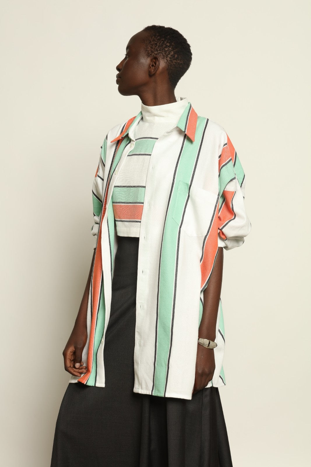 Model is wearing the Oversized Shirt with Collar by Marrakshi Life, part of House of Nomad Stories collection, handwoven cotton shirt with relaxed architectural fit, structured collar, and versatile styling
