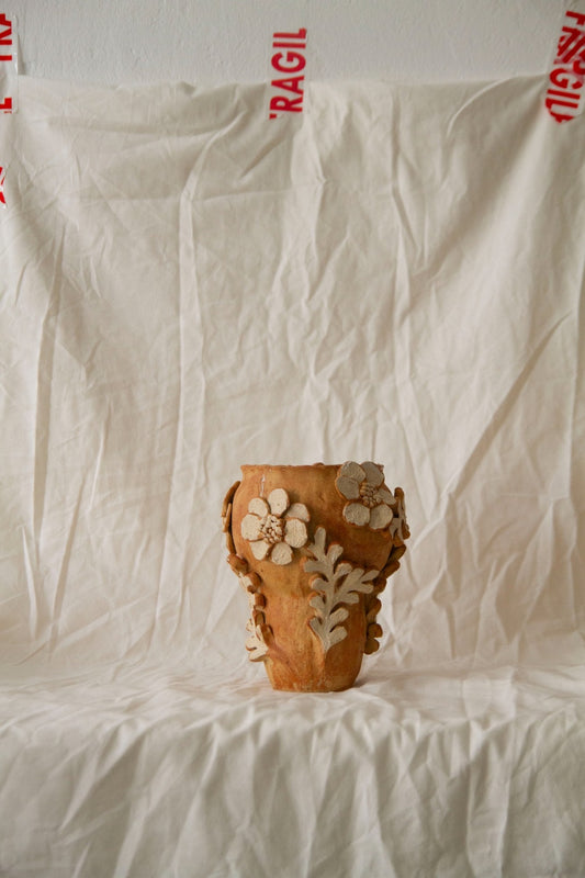 Petit Jardin n.05 by Clandestine Céramique, handmade in warm brown clay with a natural glossy glaze and hand-painted floral motifs, part of the House of Woven Stories selection.