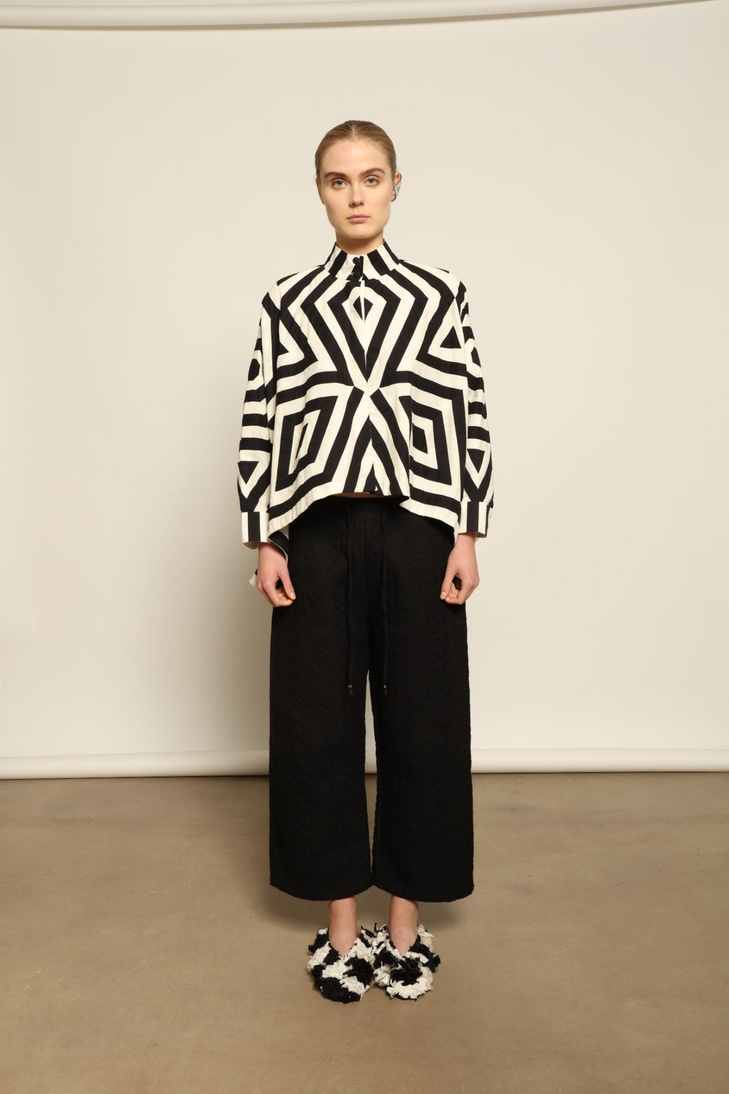 Model wearing Pure Cotton Tantra Black and White Jacket by Ka-Sha, part of the curated House of Woven Stories selection, handcrafted in India from premium cotton with hand-dyed appliqué detailing and a relaxed, artistic silhouette.