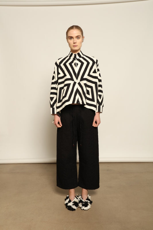 Model wearing Pure Cotton Tantra Black and White Jacket by Ka-Sha, part of the curated House of Woven Stories selection, handcrafted in India from premium cotton with hand-dyed appliqué detailing and a relaxed, artistic silhouette.