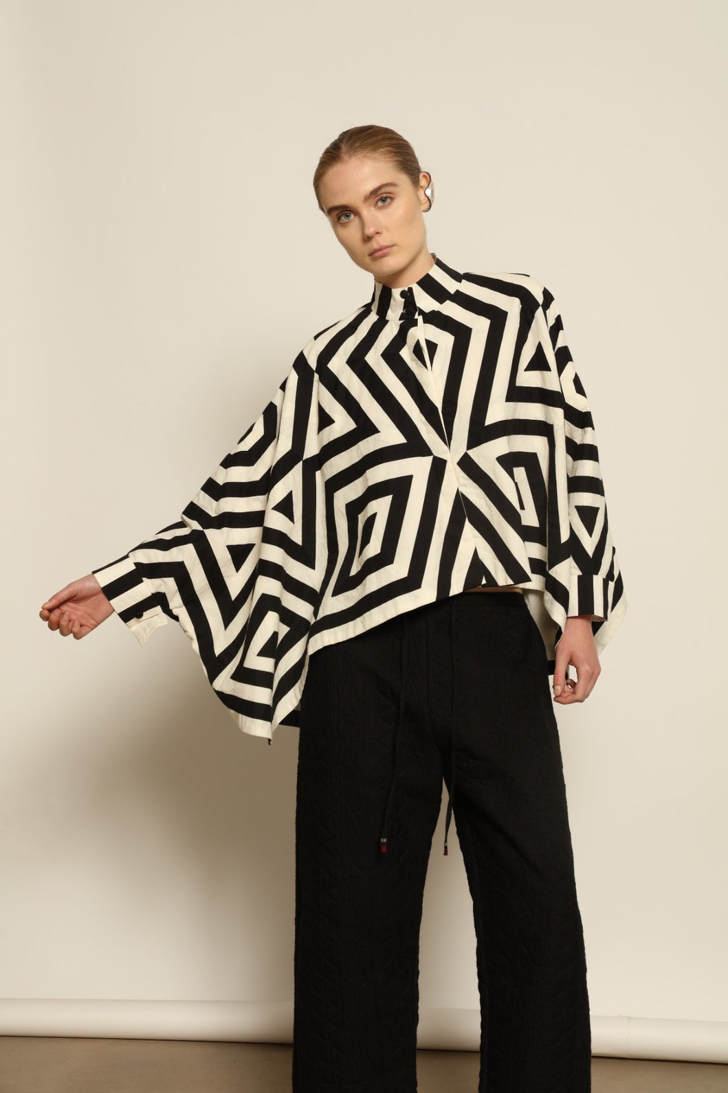 Model wearing Pure Cotton Tantra Black and White Jacket by Ka-Sha, part of the curated House of Woven Stories selection, handcrafted in India from premium cotton with hand-dyed appliqué detailing and a relaxed, artistic silhouette.