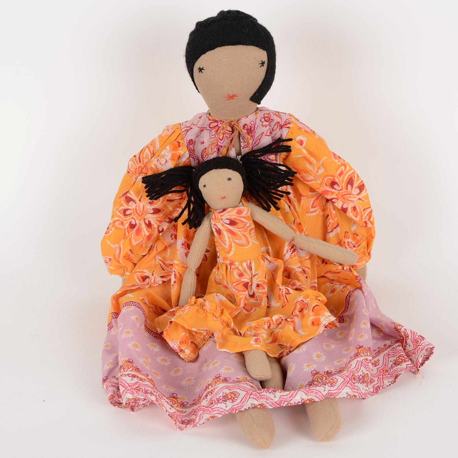 Handcrafted cloth dolls Diya and Mini by SilaiWali, mother and daughter set in traditional dresses, made from upcycled fabric. Available at House of Woven Stories.