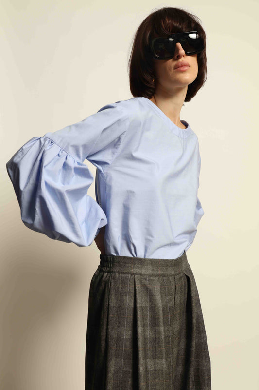 Model wearing the Sky Blue Lulu Pure Poplin Cotton Blouse with balloon sleeves by House of Woven Stories, crafted in Italy.