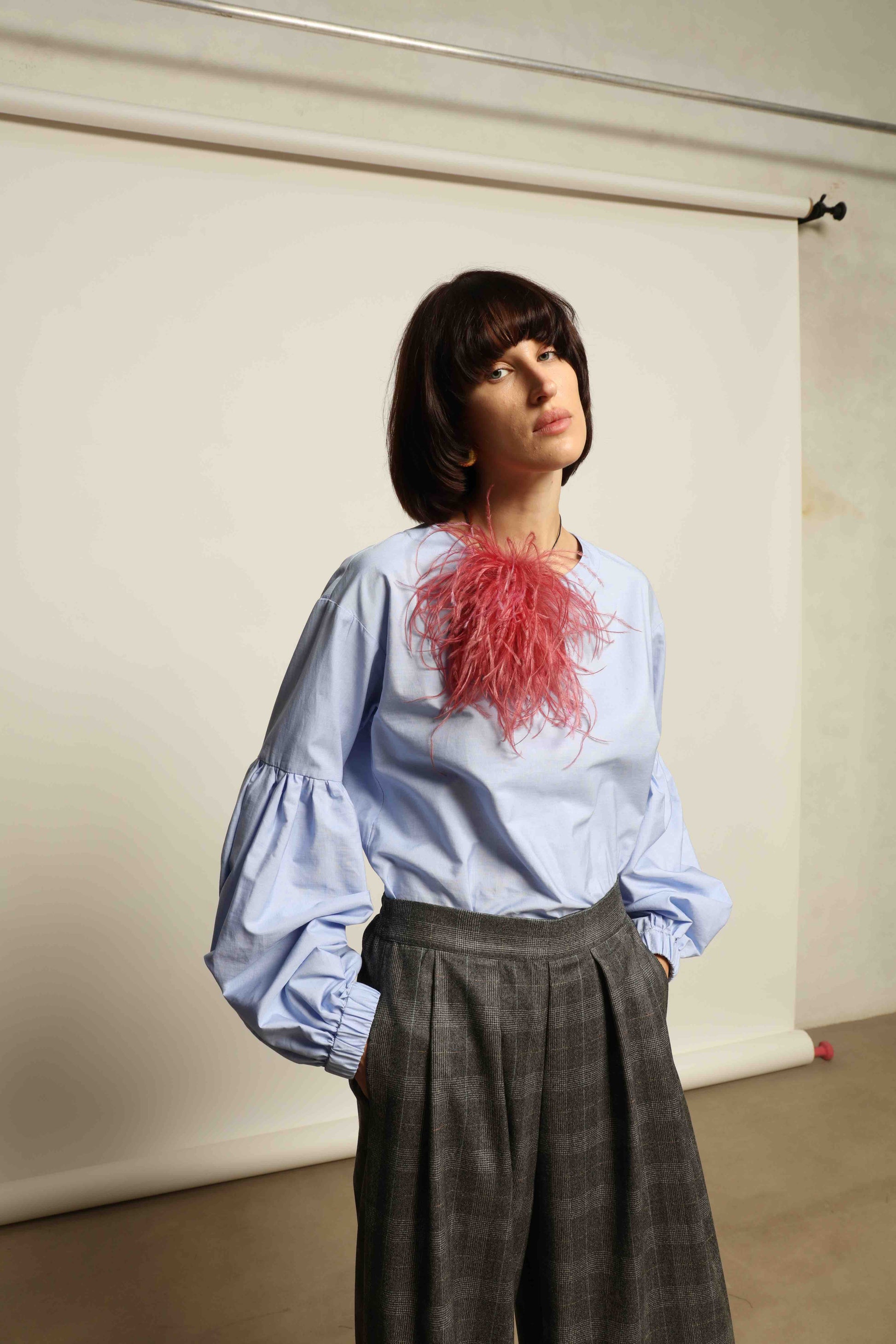 Model wearing the Sky Blue Lulu Pure Poplin Cotton Blouse with balloon sleeves by House of Woven Stories, crafted in Italy.