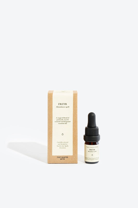 Organic essential oil blend Freyr by Smells Like Spells in elegant glass bottle with natural label, representing financial prosperity and Norse mythology, sold by House of Woven Stories.