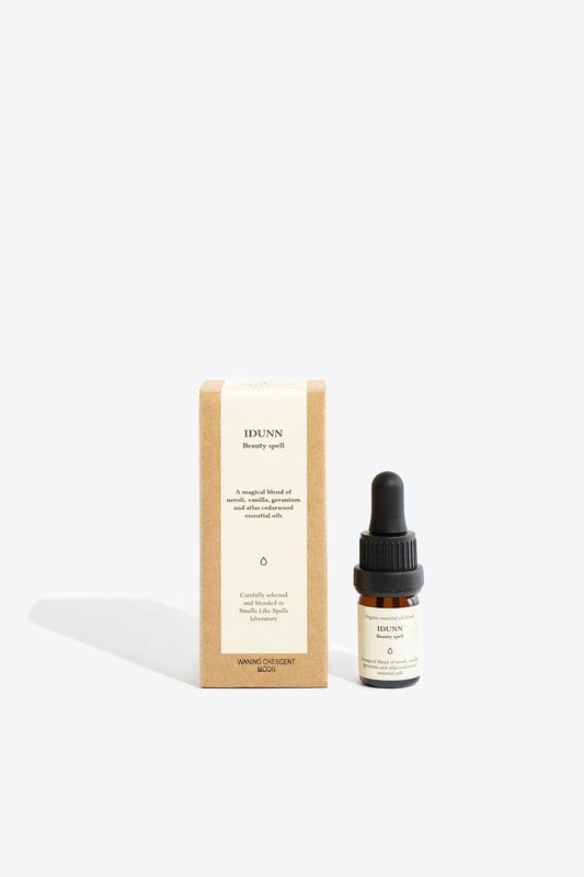 Essential organic oil blend Idunn by Smells Like Spells in amber glass bottle with dropper, natural skincare, Norse goddess of youth inspired fragrance, available at House of Woven Stories.
