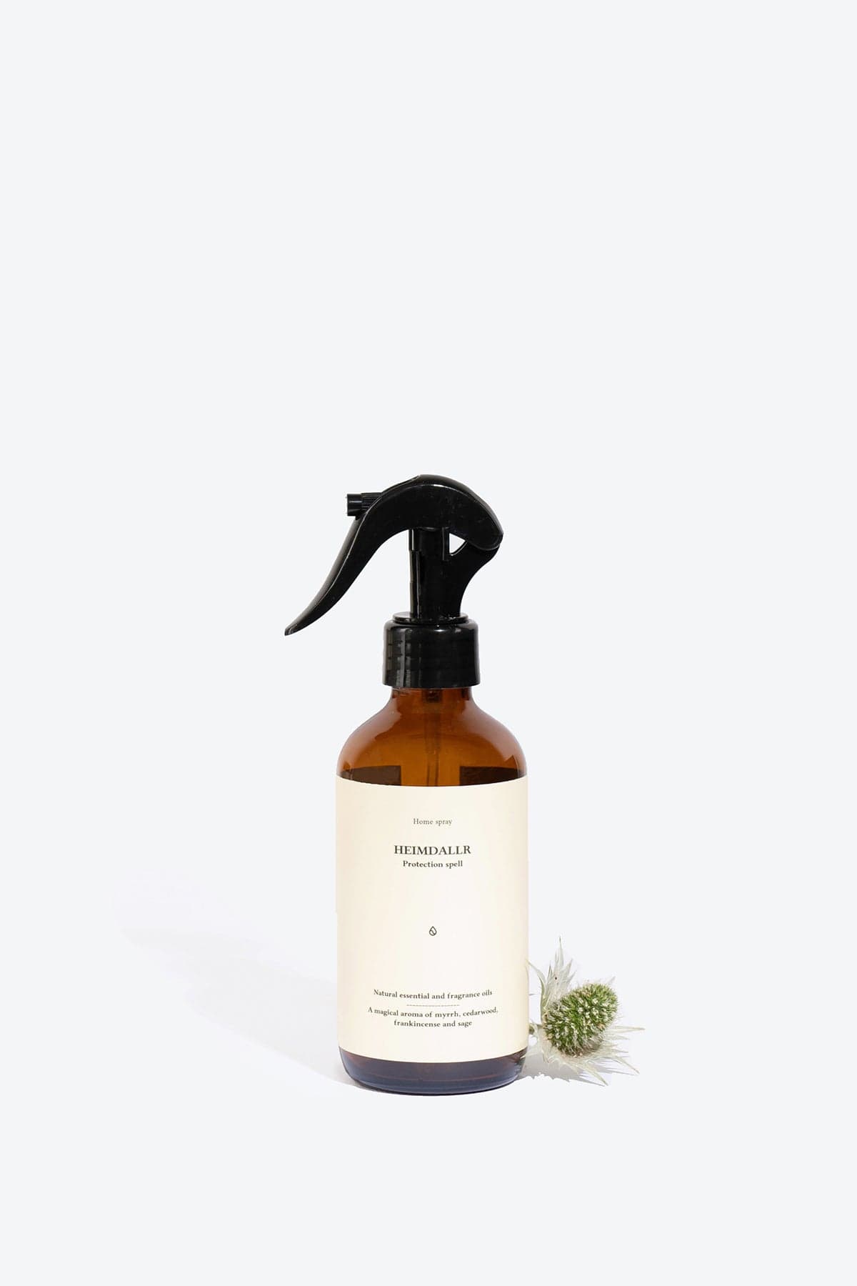 Natural Heimdallr home perfume spray by Smells Like Spells. Elegant bottle with a subtle, earthy background, evoking protection and balance through rich notes of citrus, spices, and woods.