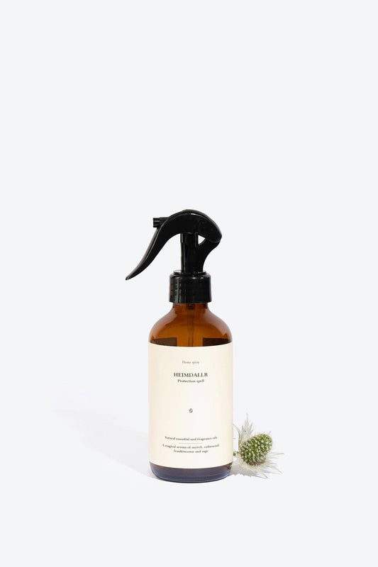 Natural Heimdallr home perfume spray by Smells Like Spells. Elegant bottle with a subtle, earthy background, evoking protection and balance through rich notes of citrus, spices, and woods.