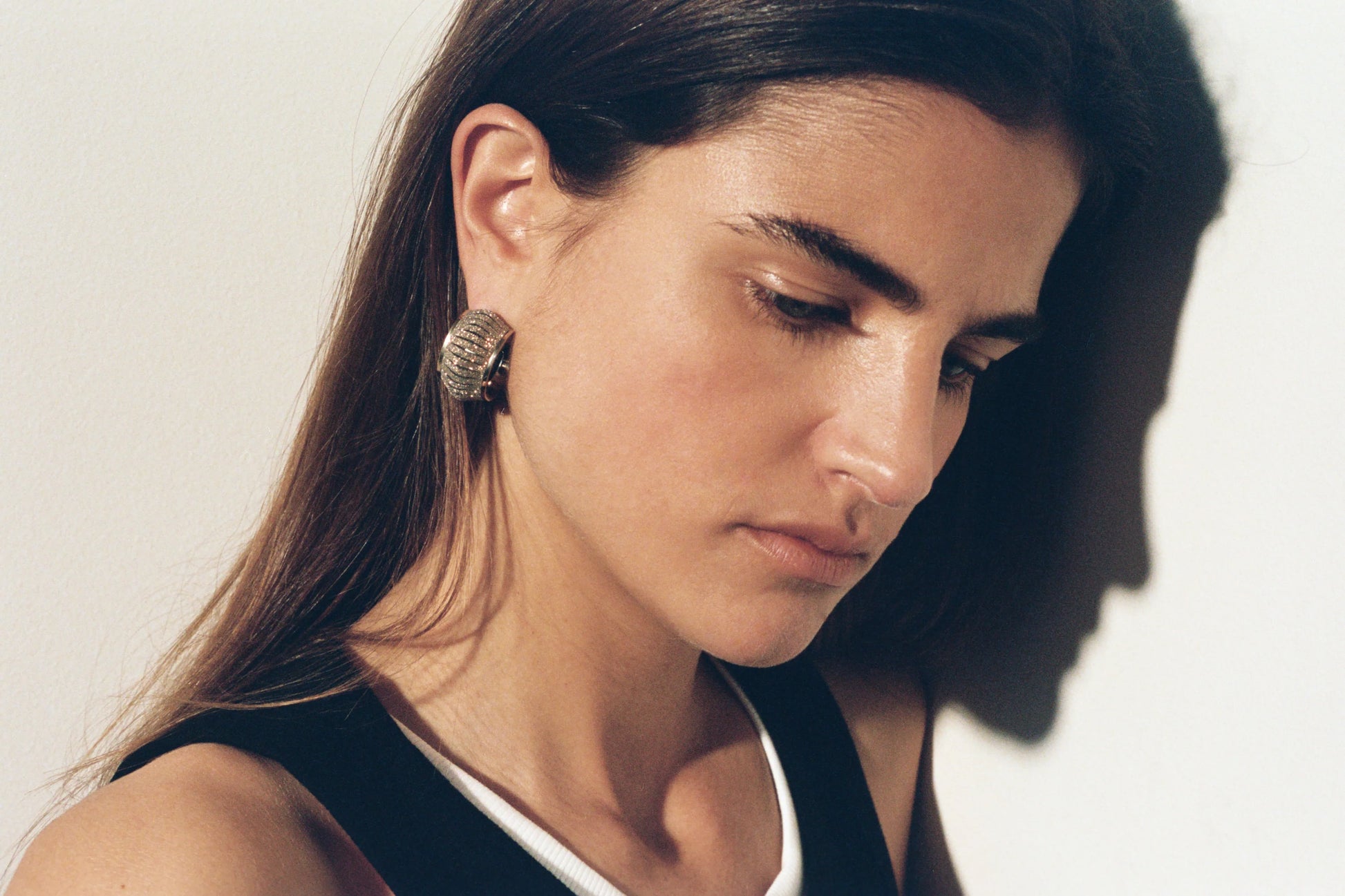 Cosmo Crystal Gold leather earrings by SO-LE STUDIO, handcrafted in Tuscany, softly rounded gold-toned design with crystal accents on the ears