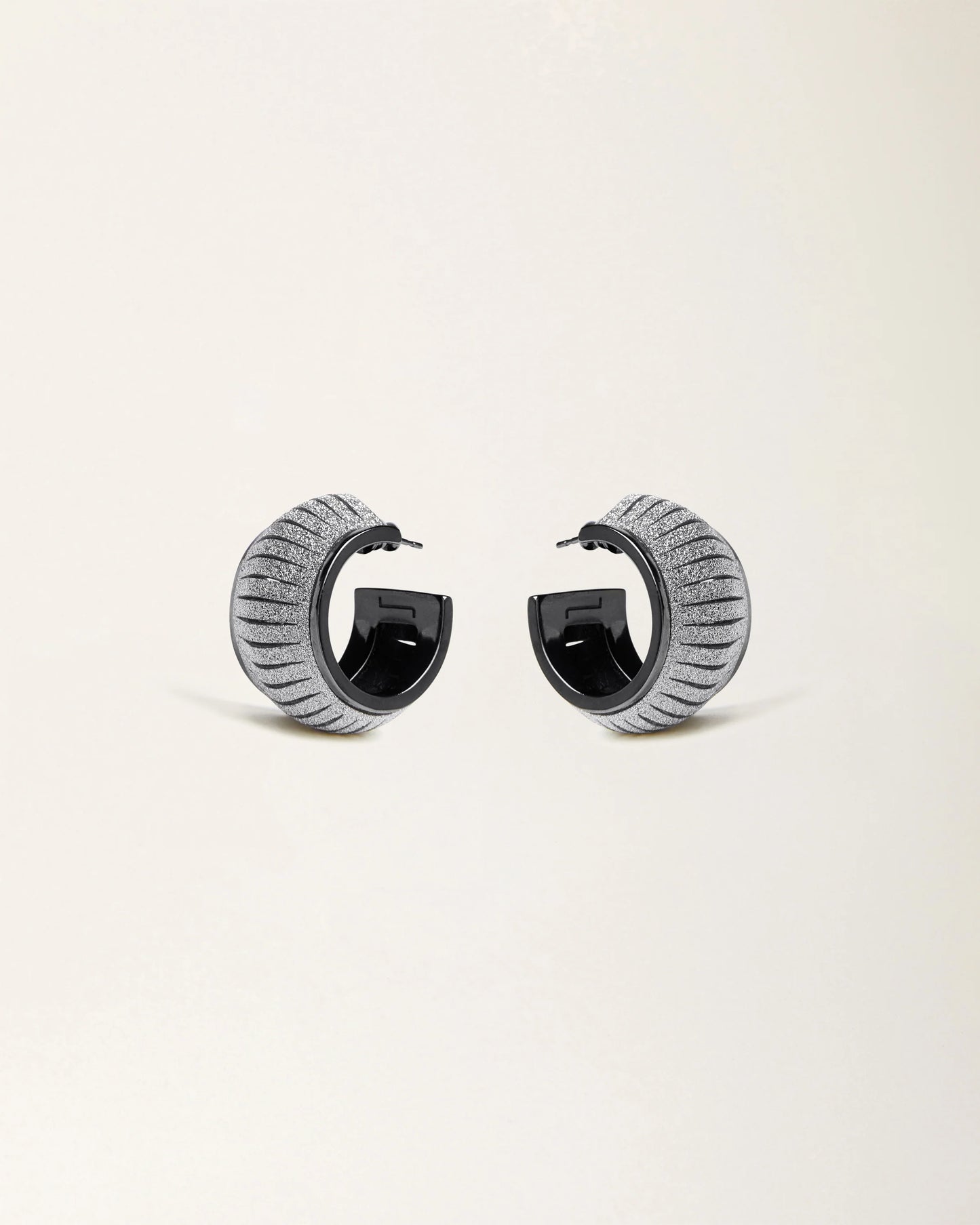Cosmo Crystal Gold leather earrings by SO-LE STUDIO, handcrafted in Tuscany, softly rounded gold-toned design with crystal accents on the ears