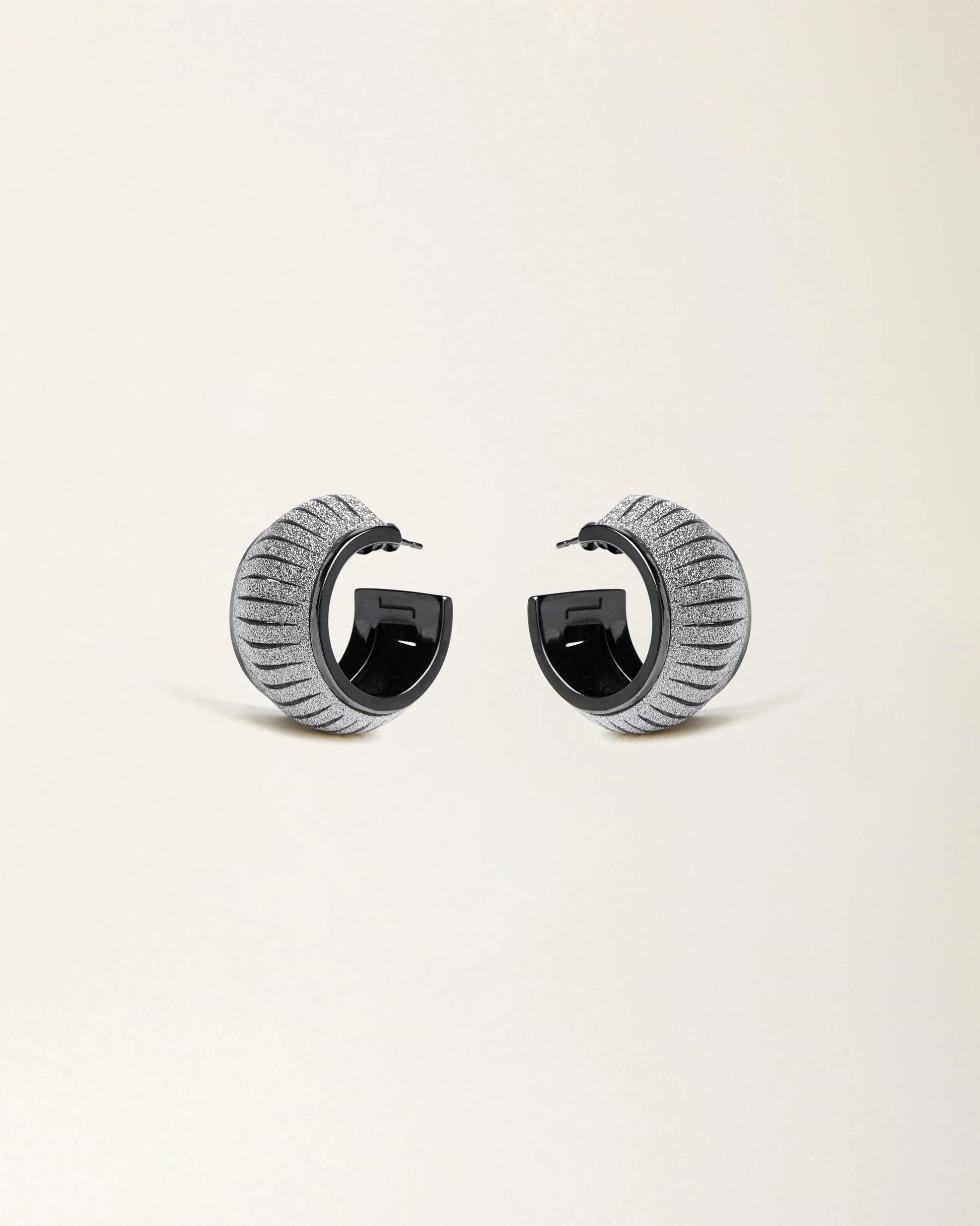 Cosmo Crystal Gold leather earrings by SO-LE STUDIO, handcrafted in Tuscany, softly rounded gold-toned design with crystal accents on the ears