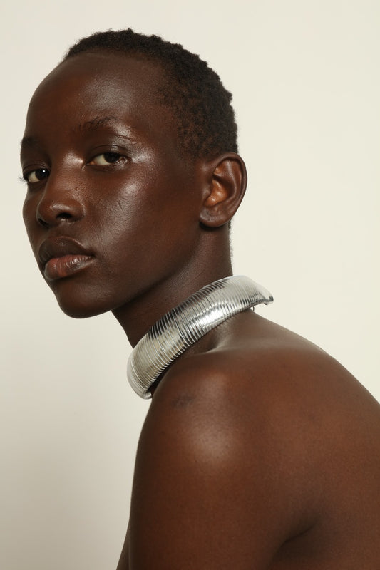 Halo Silver Foil leather necklace by SO-LE STUDIO, handcrafted in Tuscany, bold circular silver-toned design with foil finish, lightweight and sculptural on the neckline