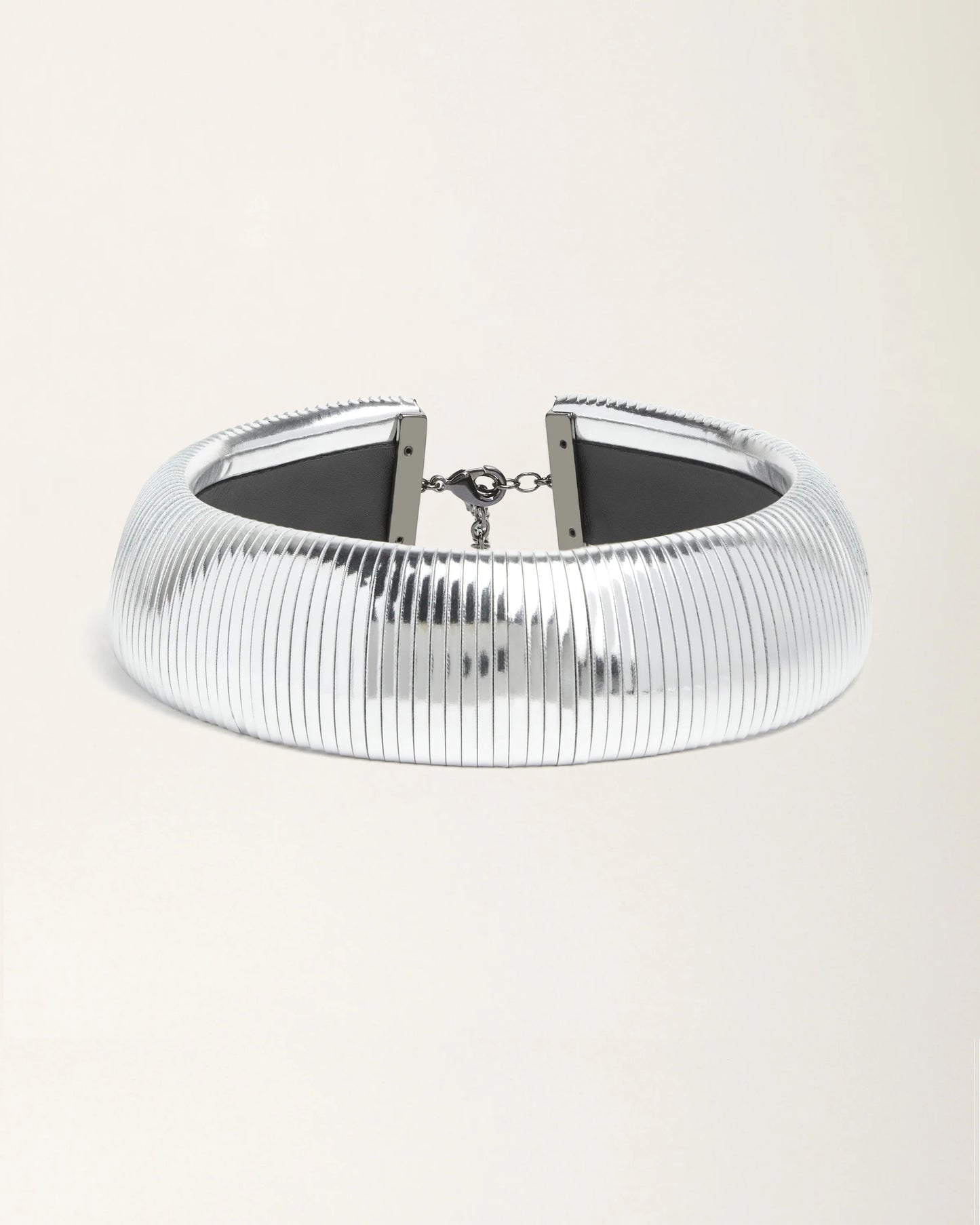 Halo Silver Foil leather necklace by SO-LE STUDIO, handcrafted in Tuscany, bold circular silver-toned design with foil finish, lightweight and sculptural on the neckline