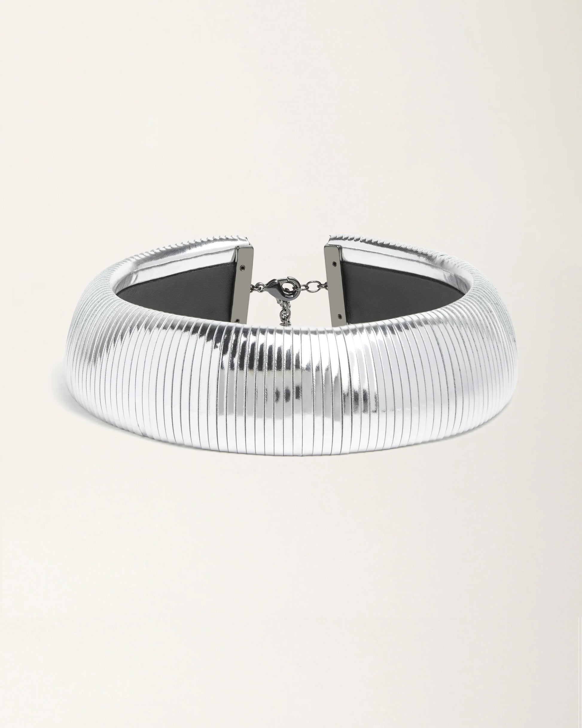 Halo Silver Foil leather necklace by SO-LE STUDIO, handcrafted in Tuscany, bold circular silver-toned design with foil finish, lightweight and sculptural on the neckline