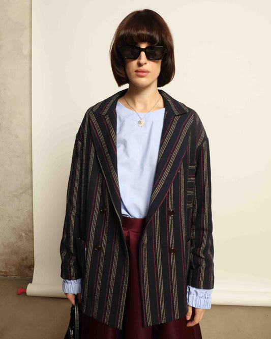 Model is wearing the Navy Blue Striped Double-Breasted Blazer by Balia 8.22, crafted in Italy from virgin wool and cotton with a structured silhouette for timeless elegance.