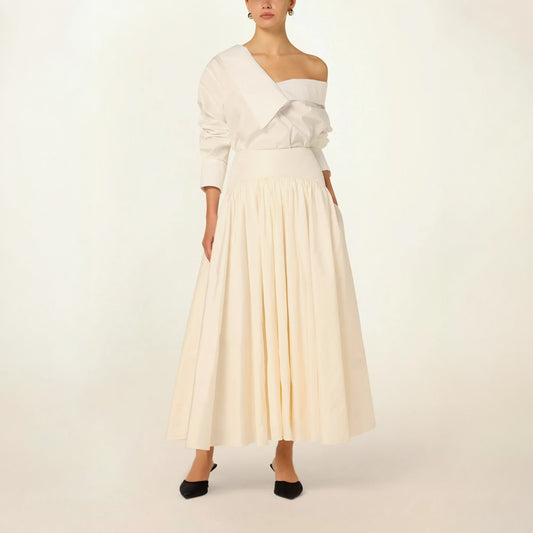 Model wearing the Suri Volume Skirt in White by Abadia from the House of Nomad Stories collection, featuring a voluminous ankle-length silhouette, tulle underlayers, and a refined satin waistband.