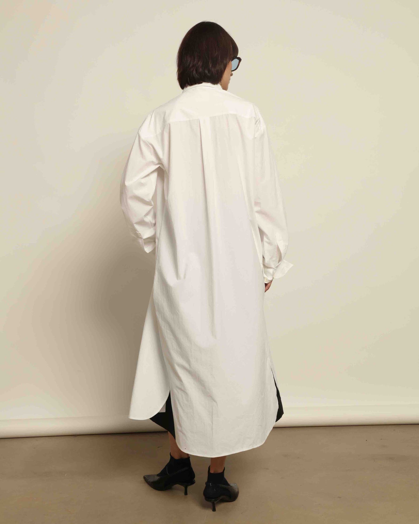 White Oscar Cotton Dress with asymmetric silk panel, crisp cotton fabric, sharp collar, and button-down front by House of Woven Stories.