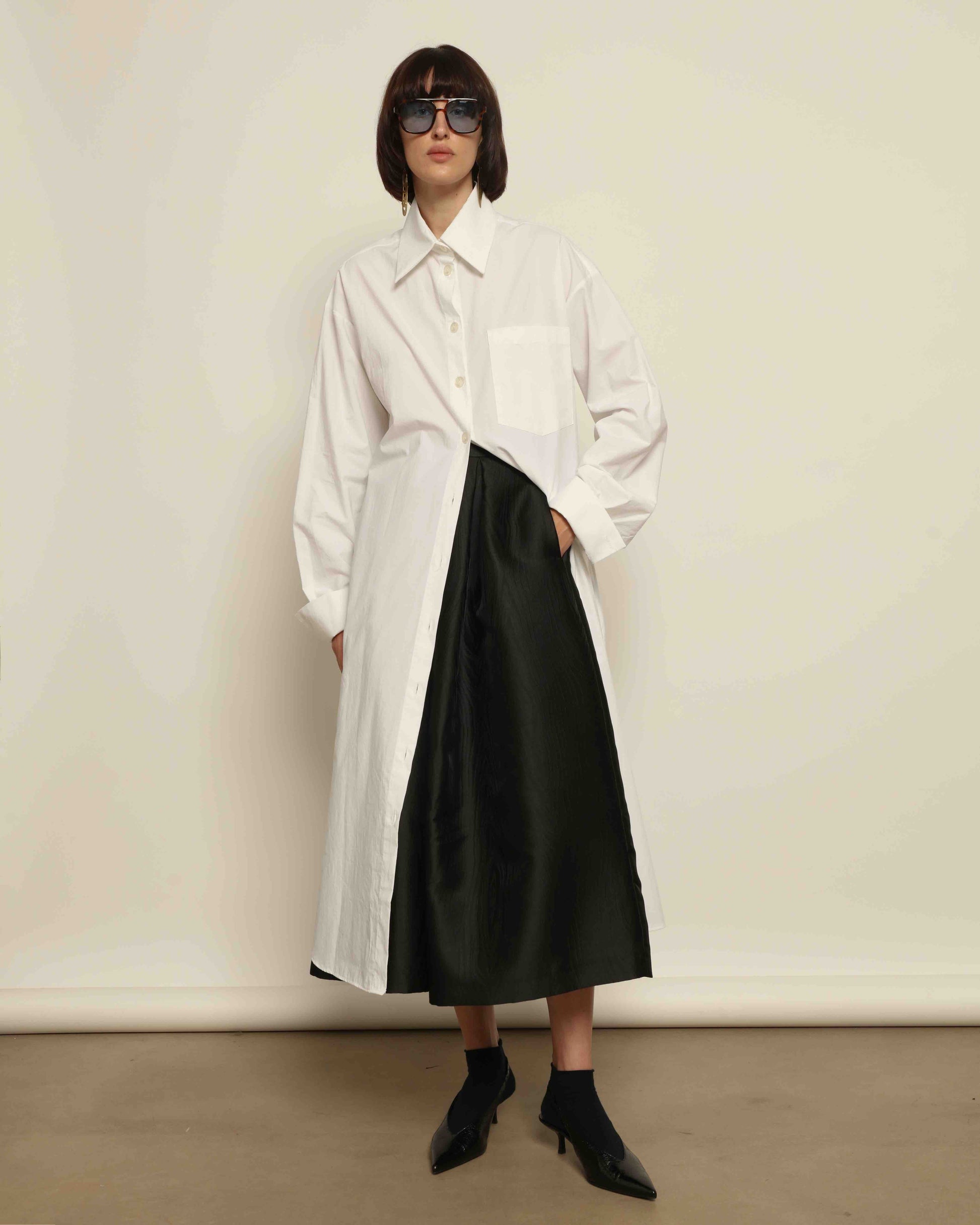 White Oscar Cotton Dress with asymmetric silk panel, crisp cotton fabric, sharp collar, and button-down front by House of Woven Stories.