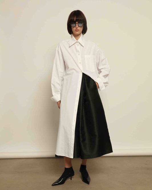 White Oscar Cotton Dress with asymmetric silk panel, crisp cotton fabric, sharp collar, and button-down front by House of Woven Stories.