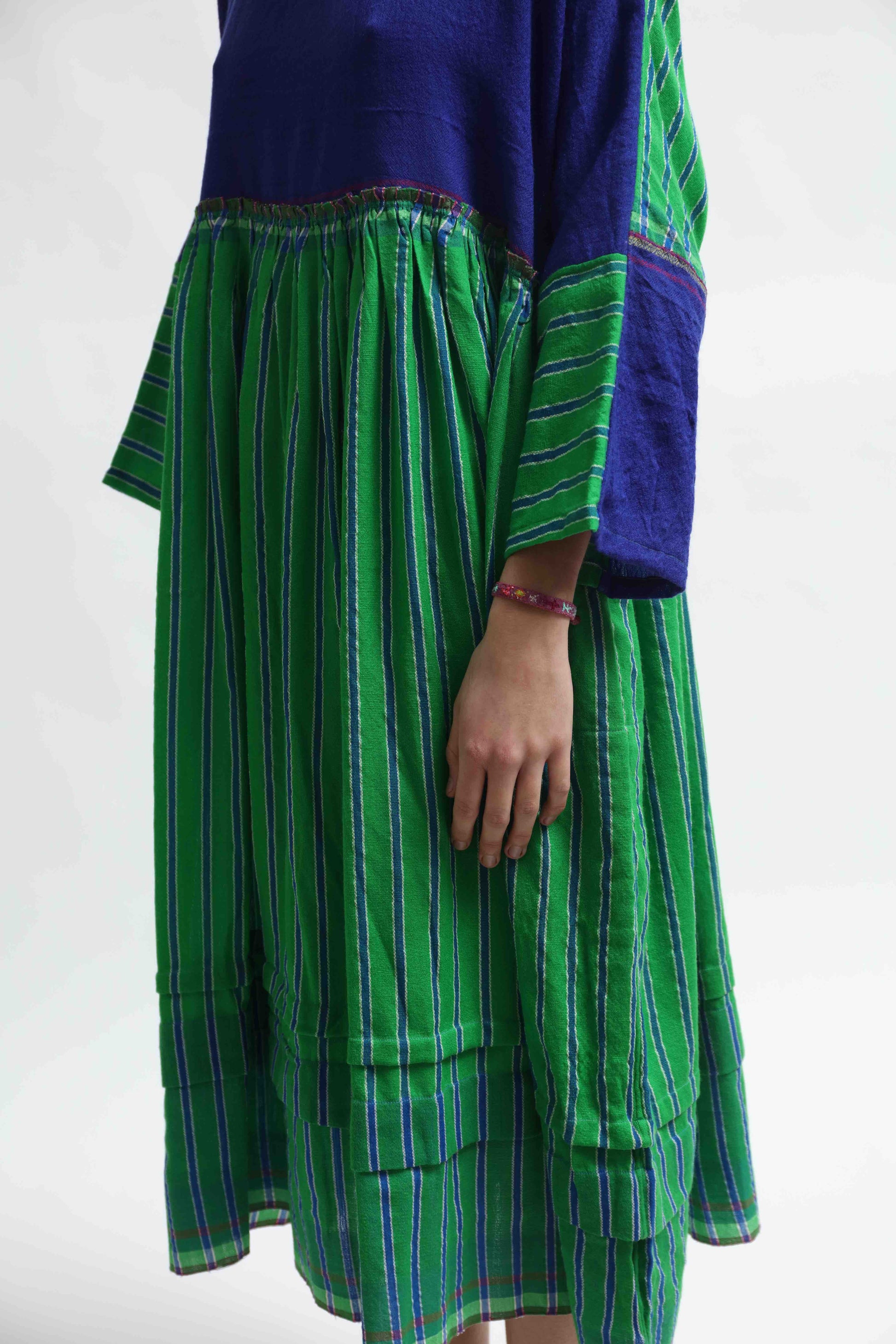 Handloom wool midi dress in indigo and green by Injiri, artisan-made in India with sustainable craftsmanship. Available at House of Woven Stories.